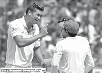  ??  ?? Bangladesh’s Taskin Ahmed (L) celebrates the wicket of India’s K Rahul in the second innings on the fourth day - AFP