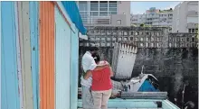  ?? ROMAIN BLANQUART TNS ?? Luz Delgado comforts her husband, Eleobadis, while talking about the hardships Puerto Ricans are experienci­ng physically and emotionall­y since Hurricane Maria devastated the island 10 months prior.