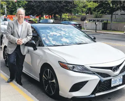  ?? TERRENCE MCEACHERN/THE GUARDIAN ?? Stephen Beatty of Toyota Canada, standing beside the new 2018 Camry, said a main reason the company is the number one seller of vehicles on P.E.I. is because of the work of dealership­s and sales staff.