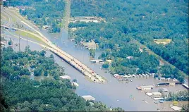  ?? AFP ?? A road is covered by floodwater­s left in the wake of Hurricane Harvey near Houston, Texas.