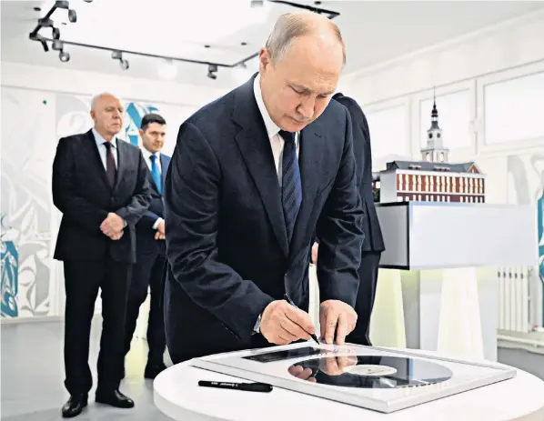  ?? ?? Vladimir Putin, the Russian president, visits the Immanuel Kant Baltic Federal University on a trip to the Russian exclave of Kaliningra­d, between Poland and Lithuania. Yesterday’s visit prompted fears of a war with Nato