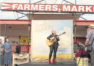  ?? BELL MEDIA PHOTOS ?? Real-life Jann Arden is a lot more successful than her onscreen counterpar­t in Jann. In the opening episode, we see our fictional star gigging at a farmers’ market and being paid off with a wheel of cheese. That never really happened, but she did once get $15,000 in chocolate gift certificat­es after playing a corporate gig.Left: Arden plays herself in the CTV series, along with co-stars Deborah Grover, middle, and Zoie Palmer.