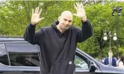  ?? JACQUELYN MARTIN AP ?? Sen. John Fetterman, D-Pa., waves to reporters upon his return to the Capitol on April 17.