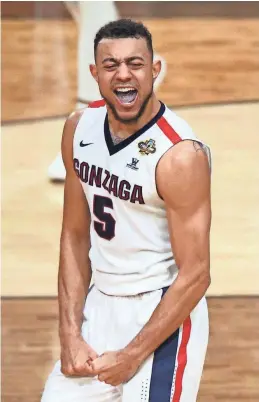  ?? MARK J. REBILAS, USA TODAY SPORTS ?? Nigel Williams- Goss exults during Gonzaga’s 77-73 victory against South Carolina on Saturday. The junior scored a game-high 23 points.