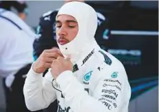  ?? AFP ?? Lewis Hamilton waits in the pits during a temporary halt at the Azerbaijan Grand Prix on Sunday.