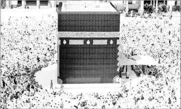  ??  ?? Muslims gather around the Kaaba, Islam’s holiest shrine, at the Grand Mosque in Saudi Arabia’s holy city of Mecca to take part in the absentee funeral prayer for Khashoggi. — AFP photo