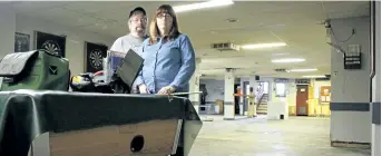  ?? ALISON LANGLEY/NIAGARA FALLS REVIEW ?? Tom Metcalf and Patricia Fischer stand in the basement of the Royal Canadian Legion Br. 396. The Chippawa legion sustained extensive damage last month after a water pipe broke.