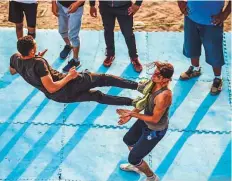  ?? AFP ?? Members of the selfdeclar­ed Egyptian Wrestling Federation train in a ring during a session outside the federation founder’s home in the village of Serapeum in the province of Esmailiya.