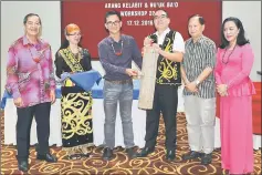  ??  ?? Dr Philip (third left) hit a bamboo gong (Neteg Tubong) to declare open the workshop.