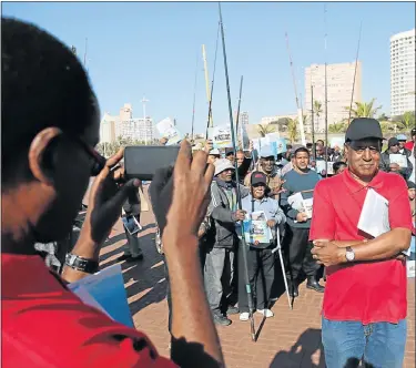  ?? Picture: JACKIE CLAUSEN ?? HIGHLIGHTI­NG ANGER: Nigerian activist Nnimmo Bassey photograph­s Des d’Sa, who wants to prevent oil and gas exploratio­n off Durban which, among other things, is killing the fish