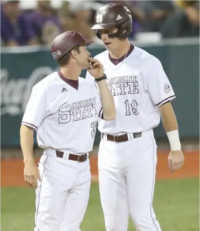  ?? Price, MSU athletic media relations, for Starkville Daily News) (Photo by Kelly ?? Brent Rooker (19) visits with Mississipp­i State third base coach Mike Brown during the season. Rooker secured the Southeaste­rn Conference triple crown after the completion of the College World Series Tuesday night.