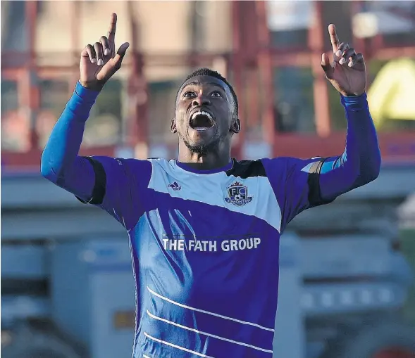  ?? ED KAISER/ EDMONTON JOURNAL ?? Tomi Ameobi of FC Edmonton celebrates after scoring on Ottawa Fury FC goalkeeper Romuald Desire Peiser at Clarke Field on Wednesday.