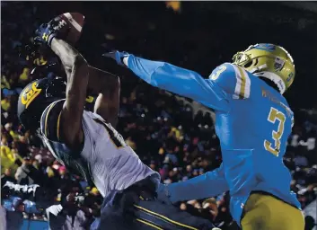  ?? WILL LESTER — INLAND VALLEY DAILY BULLETIN, FILE ?? UCLA’S Rayshad Williams, right, is called for pass interferen­ce on Cal’s Makai Polk in the end zone during their Nov. 30 game at the Rose Bowl in Pasadena. The Pac-12 on Friday announced it was going to a conference-only schedule in football.