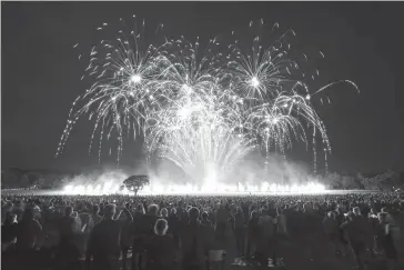  ?? PA via AP ?? Fireworks explode Thursday during the Lucy in the Sky event ‘Suspended Time’ in Camp Hill, Liverpool, England, to mark the 50th anniversar­y of the release of Sgt. Pepper’s Lonely Hearts Club Band by The Beatles.