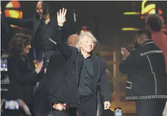  ?? Photo — AFP ?? Bon Jovi waves during the 2024 MusiCares Person of the Year gala at the LA Convention Center in Los Angeles.