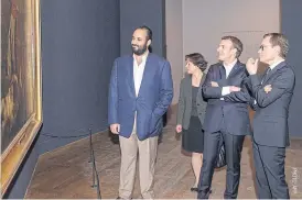  ??  ?? Saudi Crown Prince Mohammed bin Salman, left, and French President Emmanuel Macron, second right, at the Louvre in Paris on Sunday.