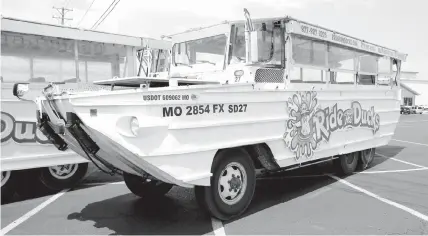  ?? ASSOCIATED PRESS ?? A duck boat sits idle in the parking lot of Ride the Ducks, an amphibious tour operator in Branson, Montana. This amphibious vehicle is similar to one of the company's boats that capsized on Table Rock Lake resulting in 17 deaths.