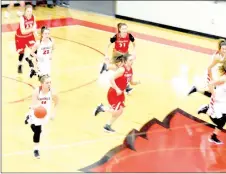  ?? MARK HUMPHREY ENTERPRISE-LEADER ?? Farmington senior Camryn Journagan leads the Lady Cardinal fast break pushing the ball up the court against Clarksvill­e. Farmington defeated the Lady Panthers 57-35 in the semifinals of the 5A West Conference tournament Thursday at Cardinal Arena.