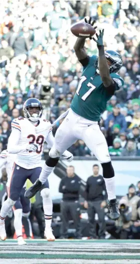  ?? | MICHAEL PEREZ/ AP ?? Former Bears wide receiver Alshon Jeffery leaps to make an eight- yard touchdown reception with five seconds left in the first half at Lincoln Financial Field.