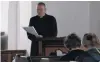  ?? PHOTO: JARED MORGAN ?? Last rites . . . Anglican Bishop of Dunedin the Right Rev Dr Steven Benford reads the paperwork to secularise St Michael’s and All Saints Church in Clyde.
