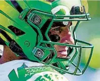  ?? GETTY IMAGES ?? Oregon quarterbac­k Bo Nix (left) North Carolina quarterbac­k Drake Maye will face off.