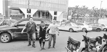  ??  ?? The alleged rape suspect, aged 17, being brought to the police station by CID personnel.