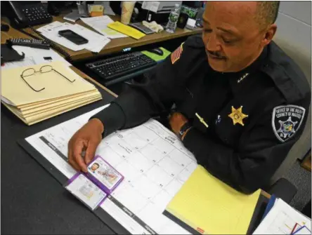  ?? PHOTOS BY JOHN BREWER — ONEIDA DAILY DISPATCH ?? Madison County Sheriff Allen Riley displays the county’s new plastic pistol permits.