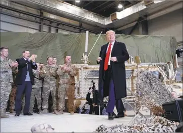  ?? Photograph­s by Alex Brandon Associated Press ?? DURING AN unannounce­d visit to Bagram Airfield in Afghanista­n, President Trump said that the Taliban, in talks with U.S. officials, wants to reach a cease-fire and that he believes “it’ll probably work out that way.”