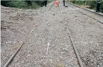  ?? ?? Stones and other material washed out from the water drains piled up above rail height at the point where the HST was derailed.