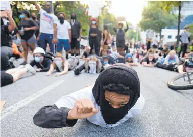  ?? Photo / AP ?? Protesters lie on a street during a demonstrat­ion over the death of George Floyd.