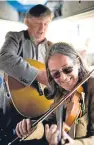  ??  ?? Ewen Sutherland, left, with his long-time friend and musical partner Dougie MacLean. Ewen has died aged 63.