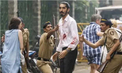  ?? Photograph: Kerry Monteen/Allstar/Screen Australia ?? Bloodied … Dev Patel in Hotel Mumbai.