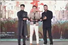  ??  ?? Left: Actors Wu Yue (left), Donnie Yen (center) and Chris Collins toast during a Beijing news conference on Nov 27 to promote the upcoming film, Ip Man 4: The Finale.