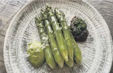  ??  ?? Lunan Bay asparagus, main; Kari Paul, manager of IJ Mellis Cheesemong­ers in Morningsid­e, Edinburgh, which stocks Lunan Bay asparagus, far right; Ondine’s asparagus dish, above