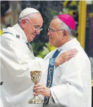  ?? Associated Press file ?? Philadelph­ia Archbishop Charles Chaput, right, holds a chalice given to him on Sept. 26, 2015, by Pope Francis during Mass at the Cathedral Basilica of Sts. Peter and Paul in Philadelph­ia.