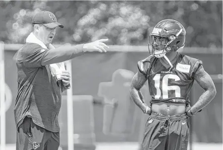  ?? Brett Coomer / Houston Chronicle ?? Coach Bill O'Brien, left, works with receiver Keke Coutee during rookie minicamp at The Methodist Training Center on Friday.