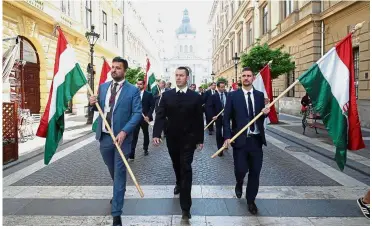  ?? — Reuters ?? Civil movement: Protesters marching along a street in Budapest to demonstrat­e against Orban.