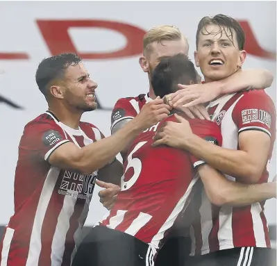  ?? PICTURE: DARREN STAPLES/SPORTIMAGE ?? ON TARGET: Sheffield United’s Sander Berge, right, celebrates after scoring against Tottenham at Bramall Lane.