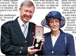  ??  ?? HONOUR: Sir Alex with wife Cathy after he was knighted in 1999