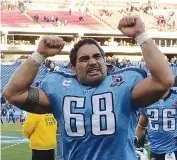  ?? AP Photo ?? ■ Tennessee Titans center Kevin Mawae (68) leaves the field after the
Titans beat the Cleveland
Browns to win the AFC
South title Dec. 7, 2008, in Nashville, Tenn. Mawae will be inducted into the Pro Football Hall of Fame on Saturday.