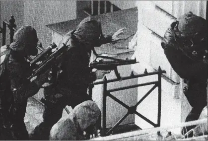  ??  ?? FABLED MISSION: Rusty Firmin – wearing no gloves – with SAS colleagues during the 1980 Iranian embassy assault. Top right: Rusty Firmin. Above: Robin Horsfall