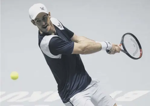  ??  ?? 0 Andy Murray plays a backhand return to Tallon Griekspoor of the Netherland­s during their Davis Cup group match in Madrid.