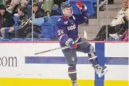  ?? Brian A. Pounds/Hearst Connecticu­t Media ?? UConn’s Hudson Schandor celebrates a go-ahead second-period goal against Quinnipiac in the finals of the annual CT Ice tournament at Quinnipiac University in Hamden on Jan. 27.