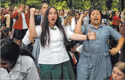  ?? Vincent Thian The Associated Press ?? Students perform the haka Monday during a vigil to commemorat­e victims of Friday’s shooting in Christchur­ch, New Zealand.