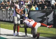  ?? Michael Perez / Associated Press ?? The Giants’ Odell Beckham, right, celebrates with Sterling Shepard after scoring a touchdown during Sunday’s game against the Eagles.