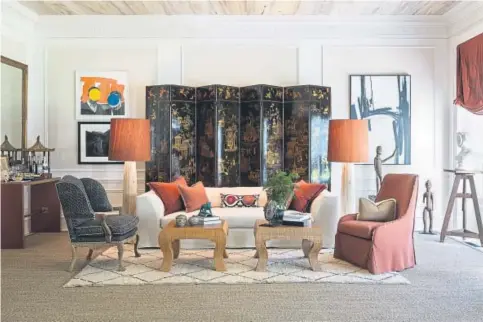  ?? Angie Seckinger, Provided by Josh Hildreth Interiors ?? Collection­s often look best against a neutral wall color. However, sometimes a bold color wraps together an eclectic collection, says designer Josh Hildreth.