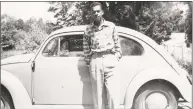  ??  ?? Walter (Junie) Palmer with a late 1950s or early 1960s VW Beetle.