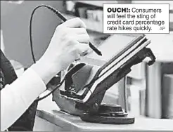  ?? AP ?? OUCH!: Consumers will feel the sting of credit card percentage rate hikes quickly.