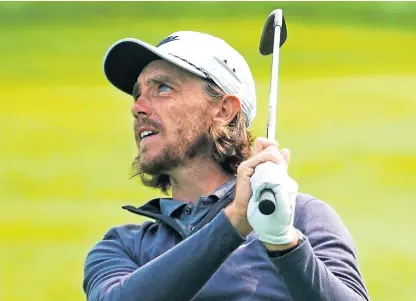  ?? Picture: AP. ?? Tommy Fleetwood watches his shot from the 11th fairway during practice yesterday.