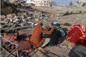  ?? — AFP photo ?? A Palestinia­n man comforts another as they inspect the destructio­n in Rafah, following overnight Israeli air strikes on the southern Gaza Strip border city amid ongoing battles between Israel and the Palestinia­n Hamas movement.